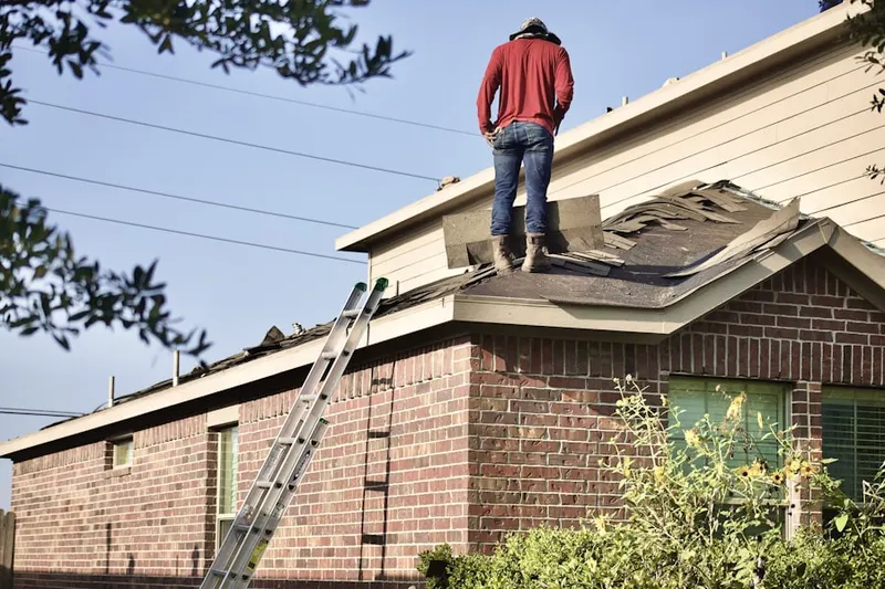 Professional roofer working on a residential roof in Rancho Diego